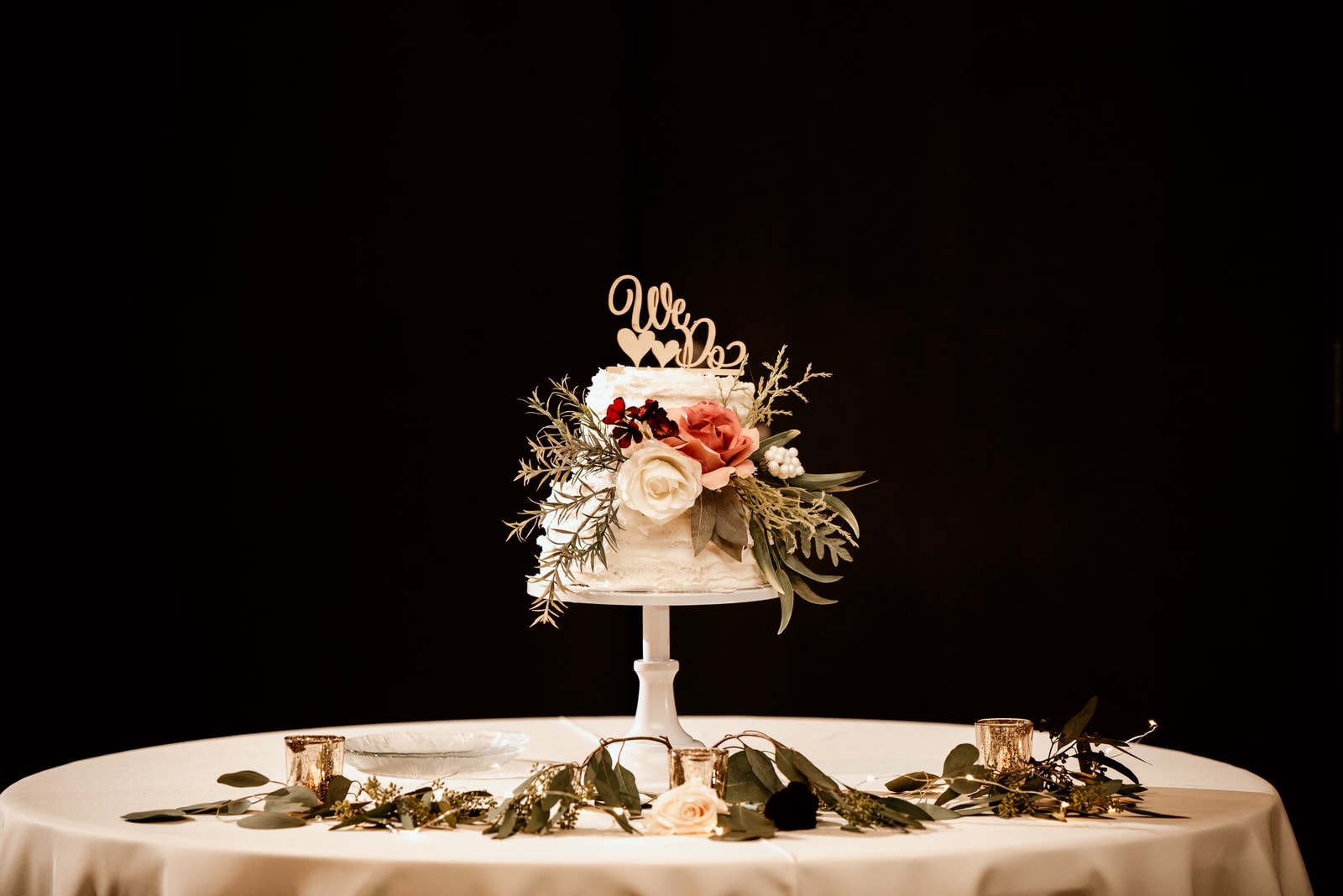 Wedding Cake on a table with roses