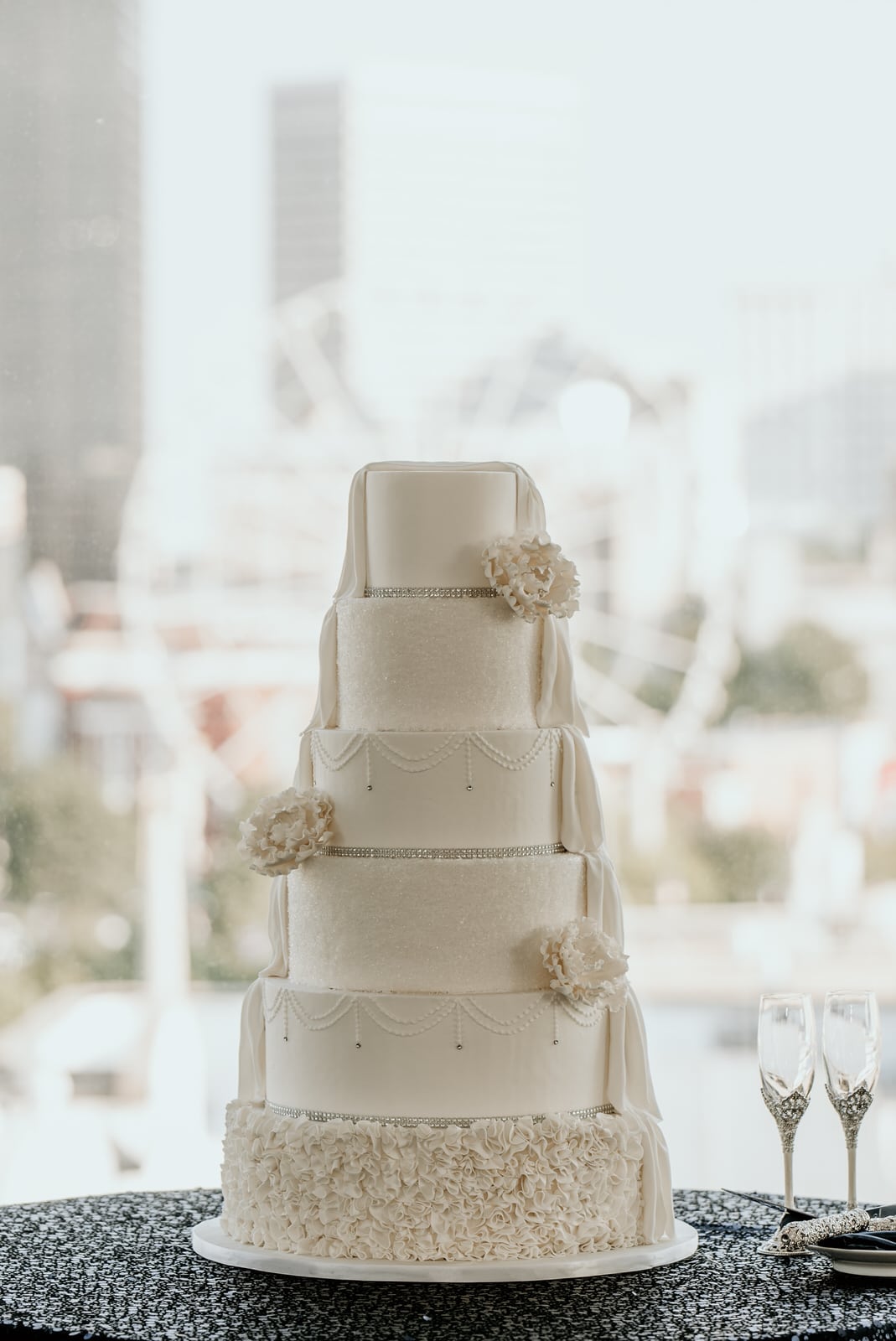 Draped wedding cake with Skyview Atlanta ferris wheel in the background