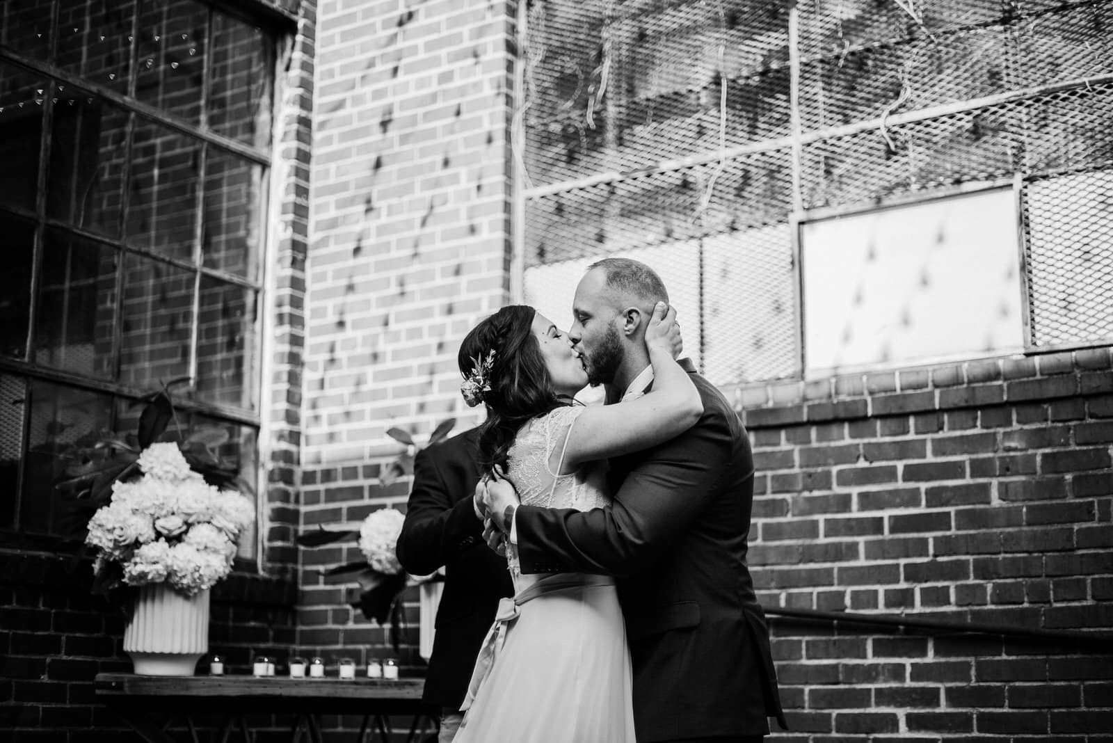 bride and grooms first kiss