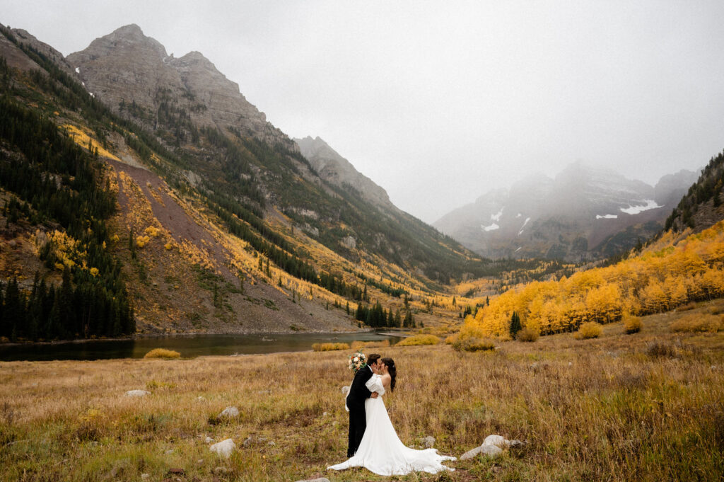 bride and groom during their fall Maroon Bells Amphitheater Wedding