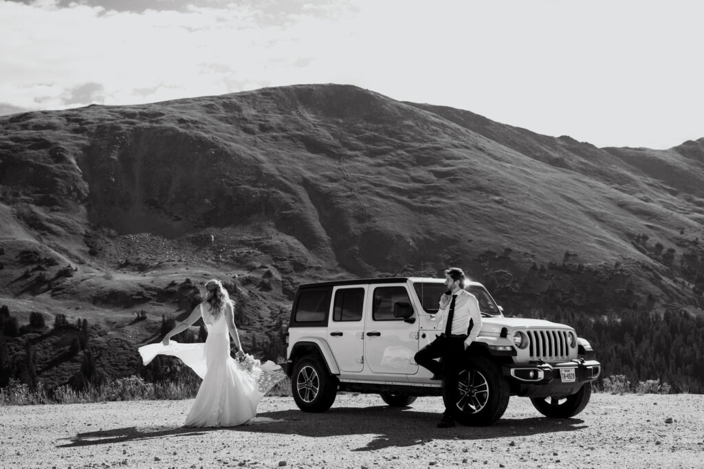 bride and groom during their breckenridge elopement with a jeep