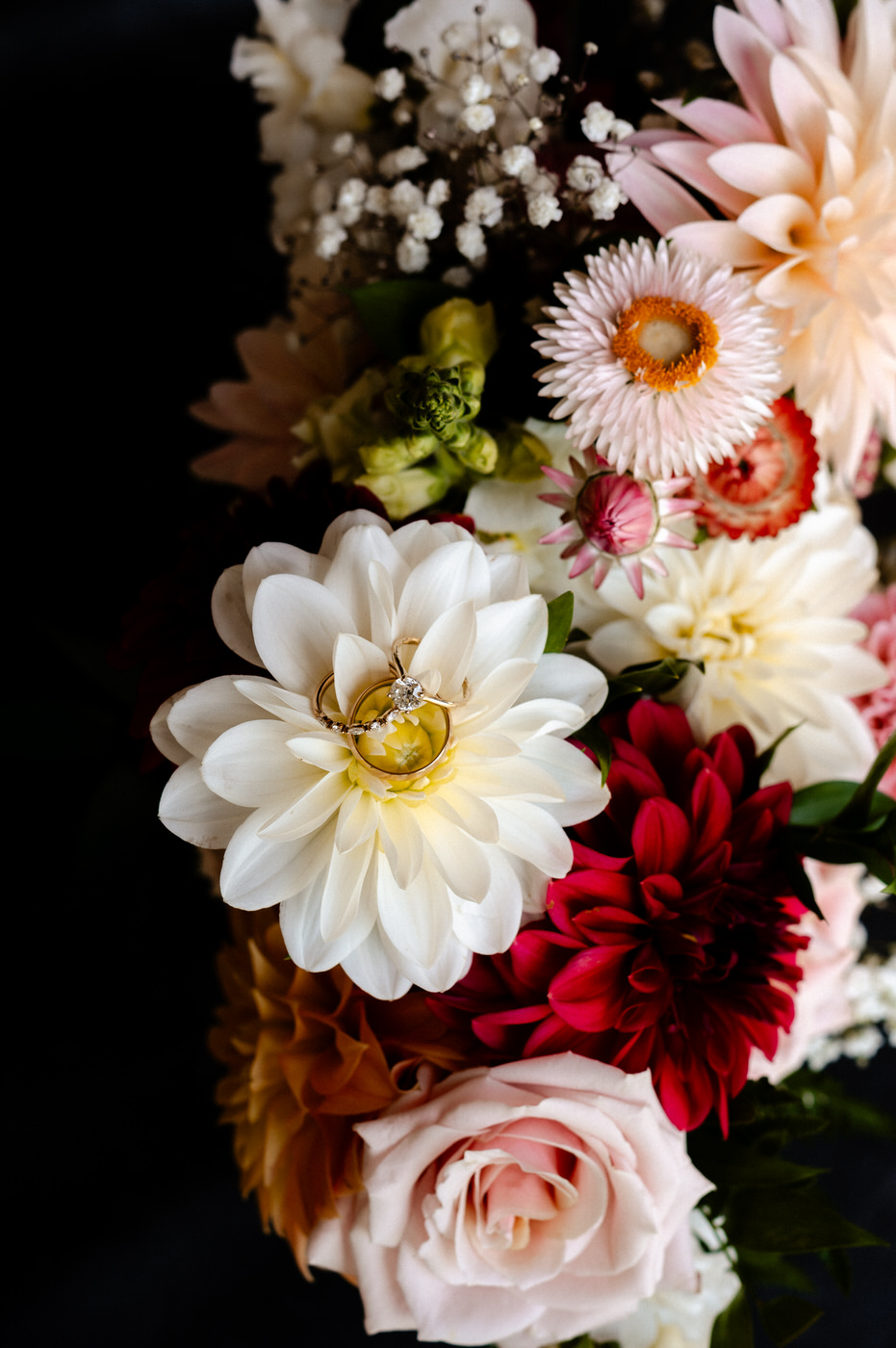 Wedding rings on a bouquet of flowers