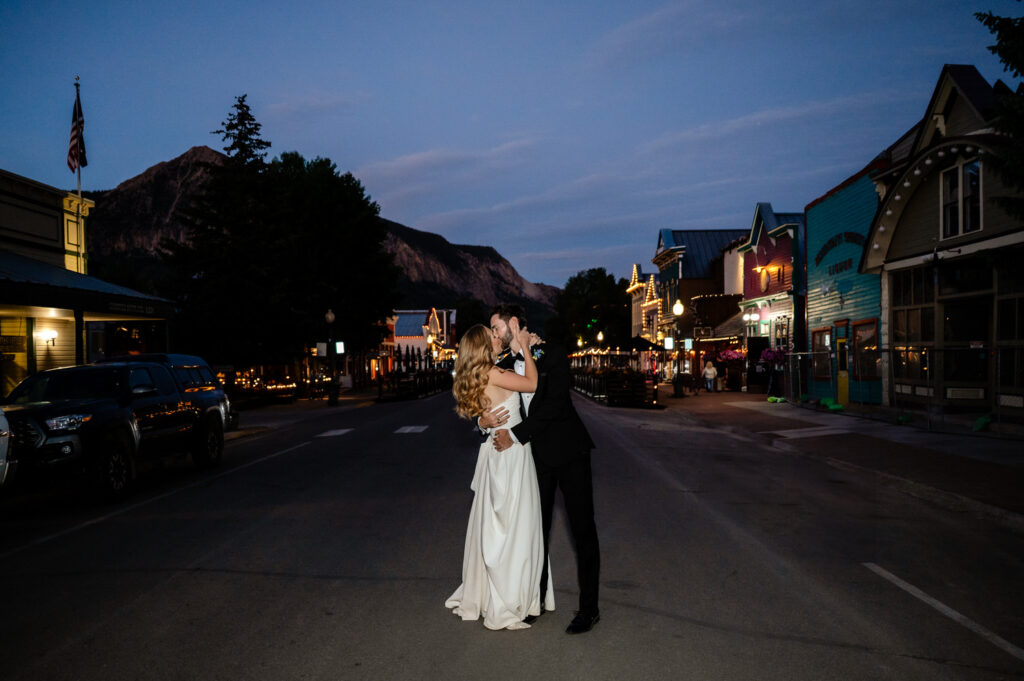 crested butte town at night with bride and groom in street